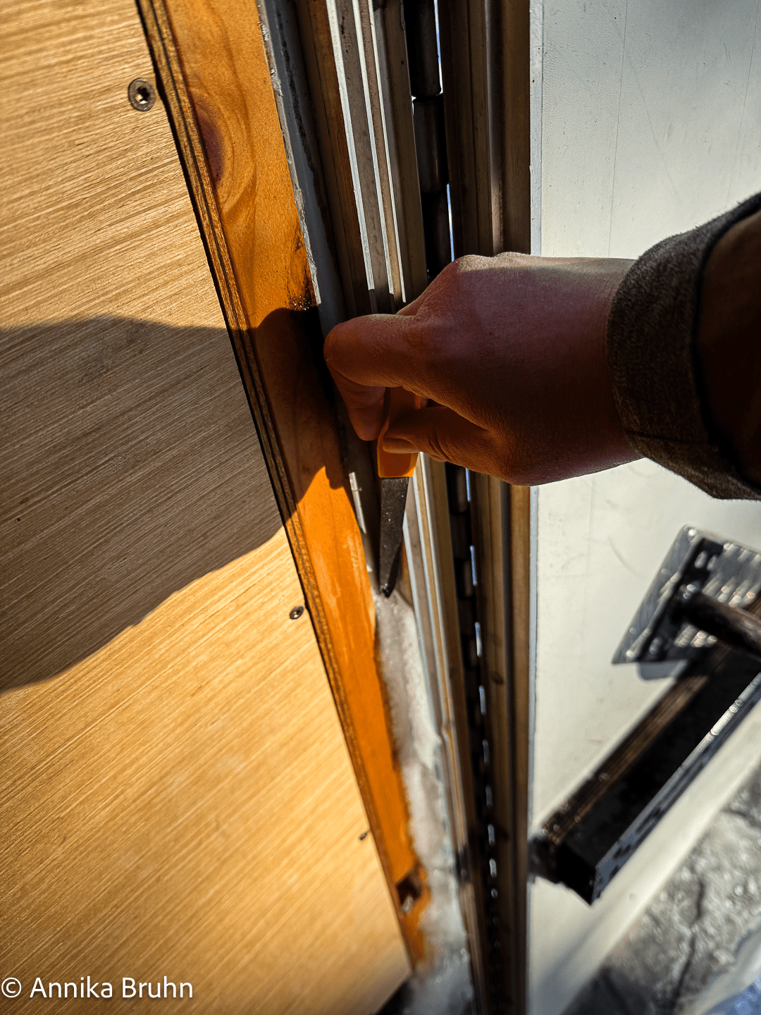 Schweres Gerät die Nagelfeile um das Eis zu entfernen